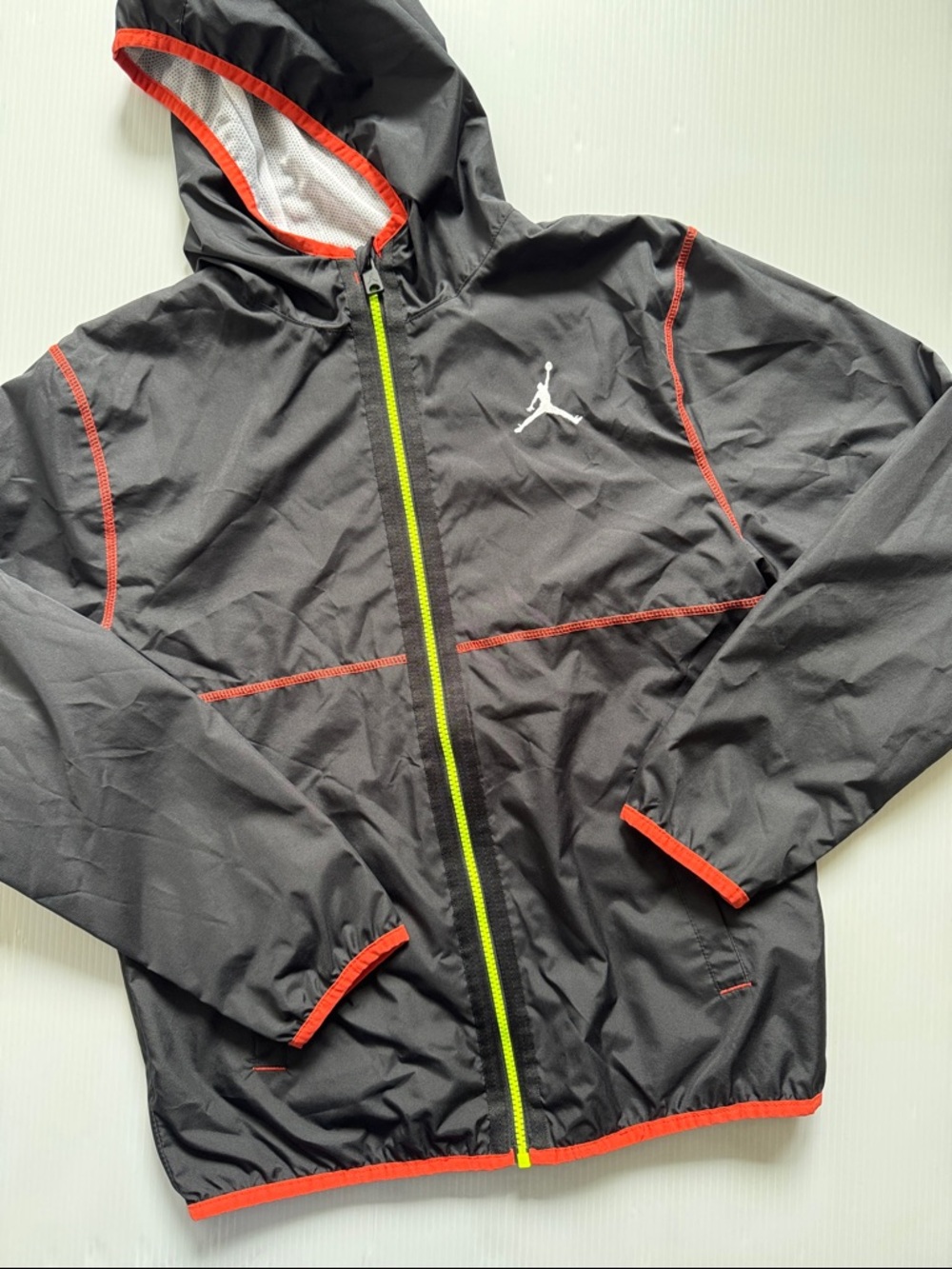 Air Jordan Black, hooded Windbreaker Jacket with Neon Zip. Youth Size XL